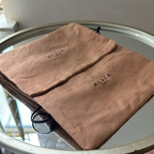 2 dust bags by Alaia Paris.